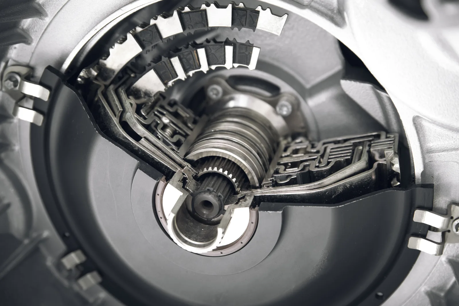 Cutaway of an automotive transmission showing clutch plates and shafts