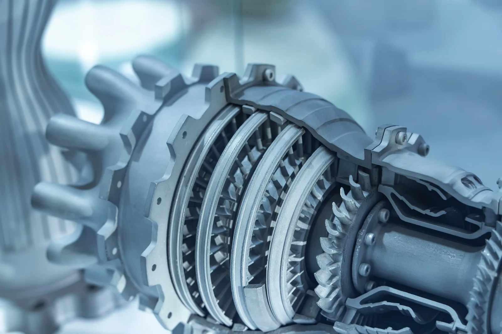Cutaway of an aero engine section showing compressor blades and gearing