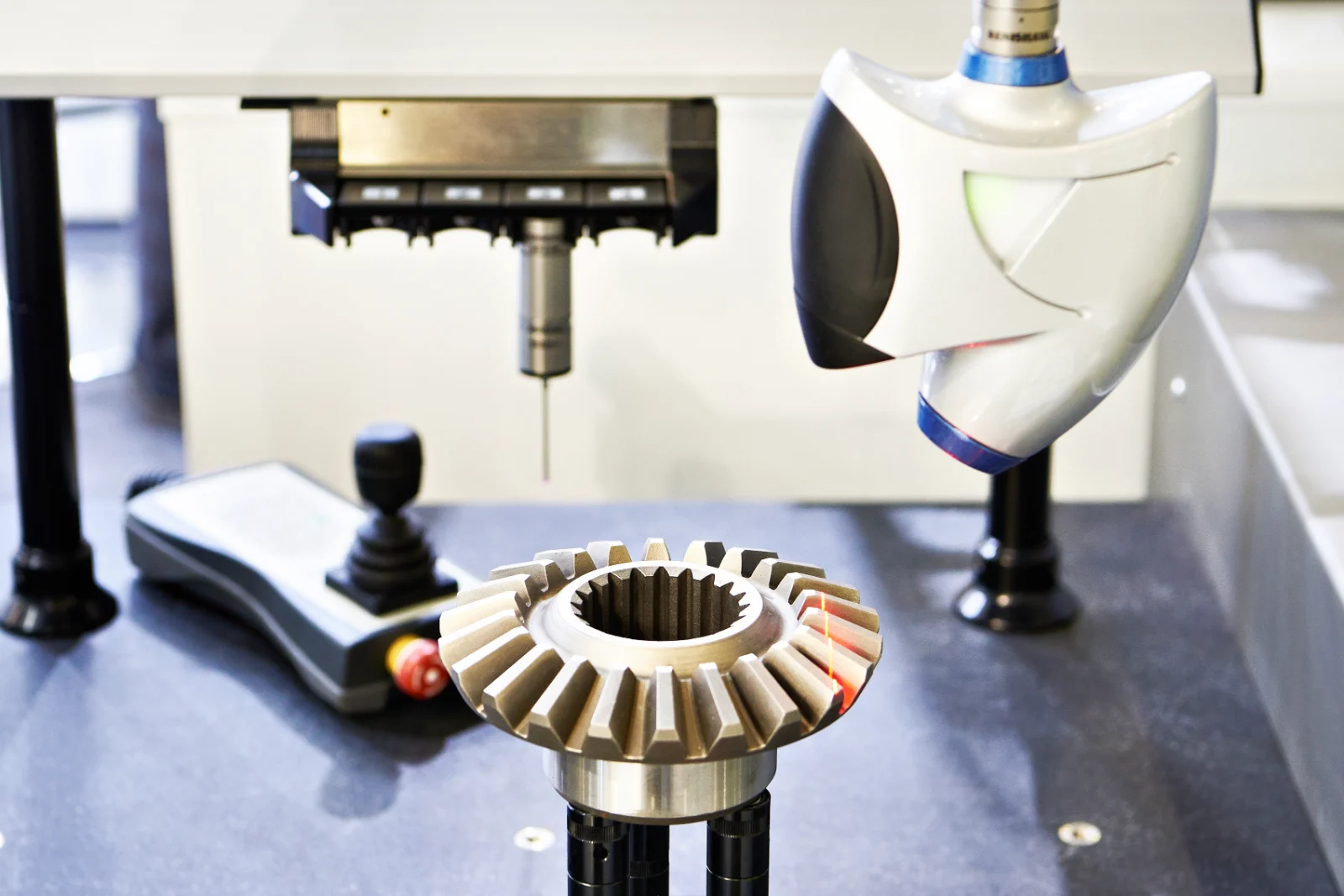 Optical inspection camera scanning small metal parts on a rotating stage