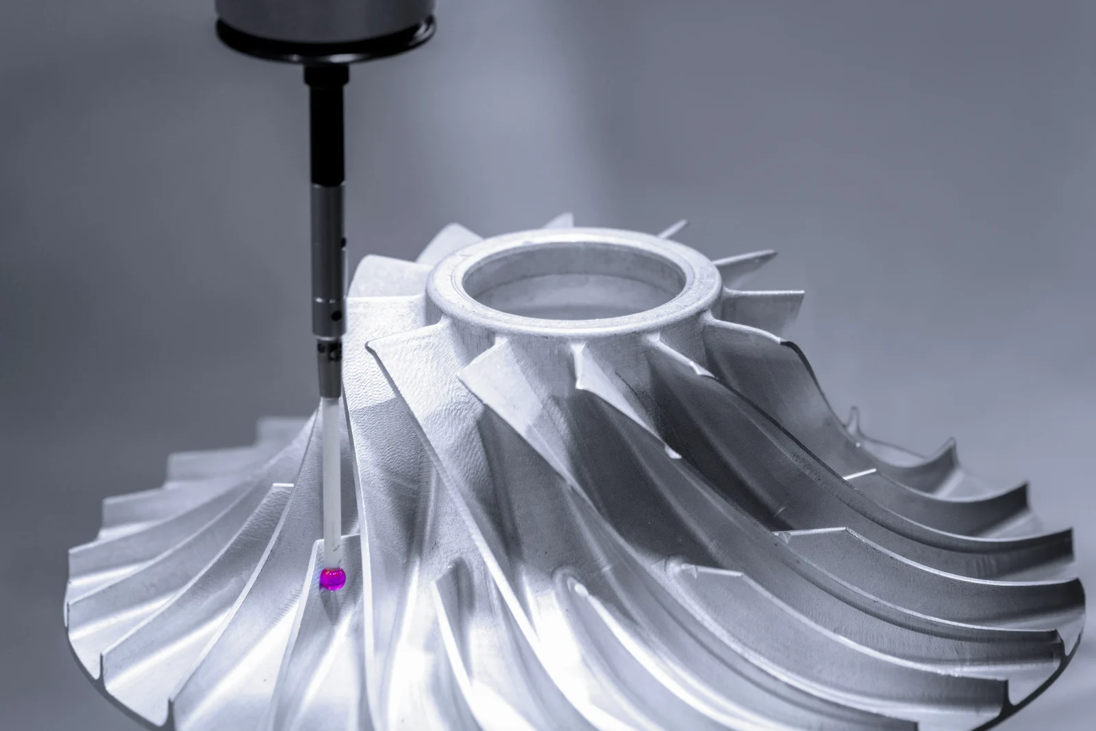 CMM stylus measuring the vane surface of an aluminium impeller